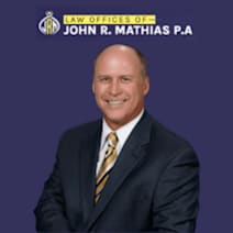 The Law Offices of John R. Mathias, P.A. law firm logo