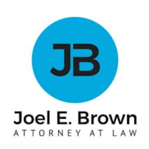 Joel E. Brown, P.C. law firm logo
