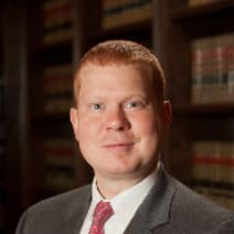 Law Office of Adam Woody law firm logo